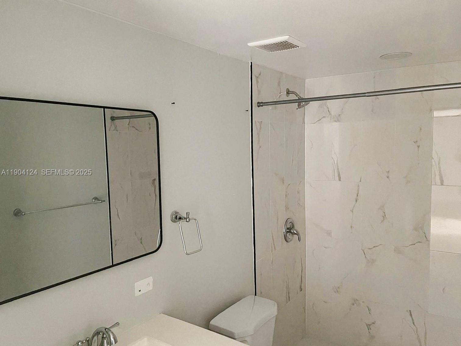 10090 Northwest 80th Court, Unit 1340 Hialeah Gardens, FL 33016 - Photo 14 of 17 a bathroom with a shower and a toilet