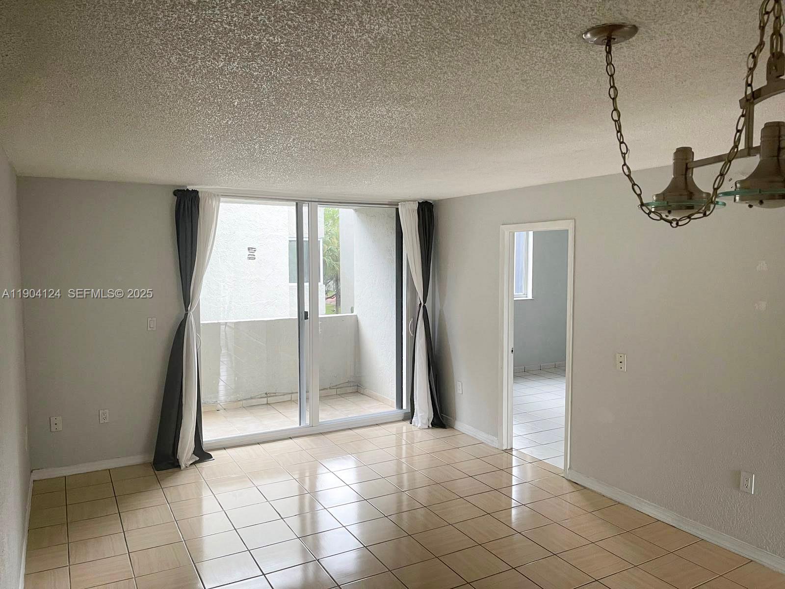 10090 Northwest 80th Court, Unit 1340 Hialeah Gardens, FL 33016 - Photo 5 of 17 a view of a interior of the house