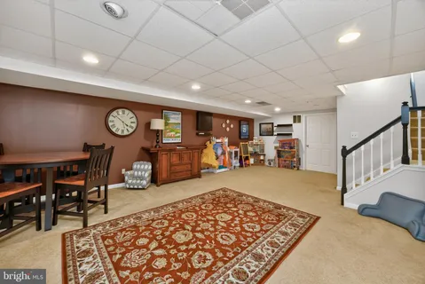 a view of a livingroom with furniture and a rug