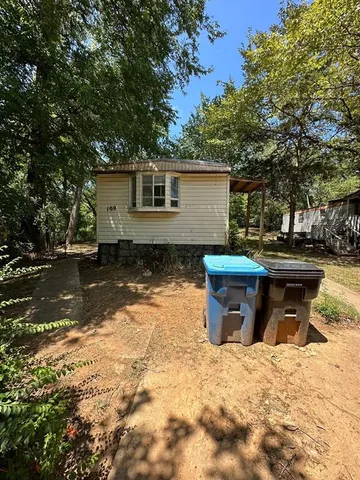 a view of a backyard with a fountain