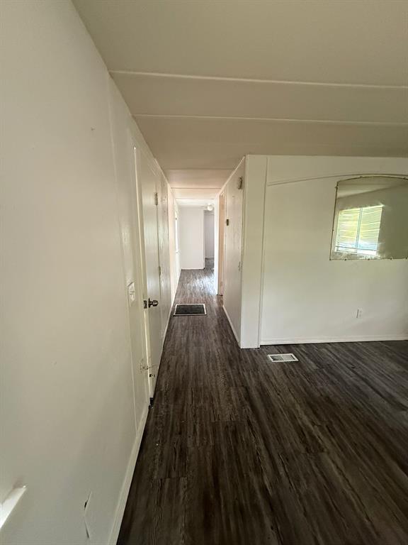 109 East Prospect Street Denison, TX 75021 - Photo 8 of 16 a view of a room with wooden floor and a window