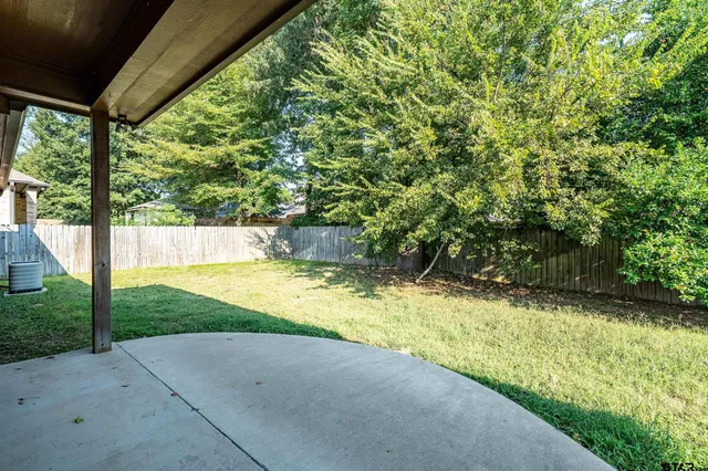 a view of yard with swimming pool