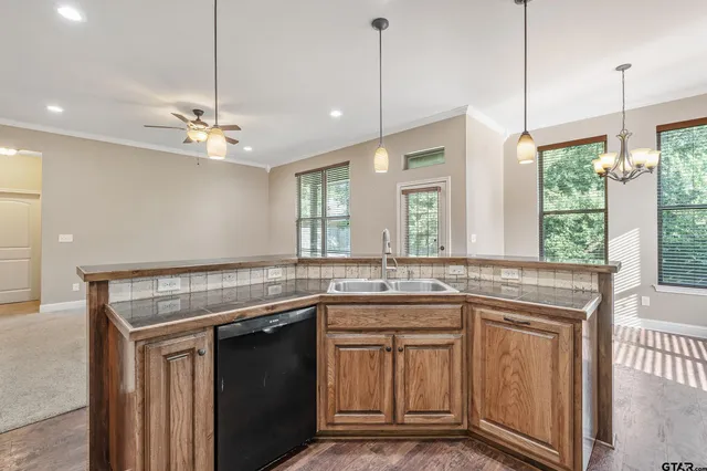 a kitchen with a sink stove and cabinets