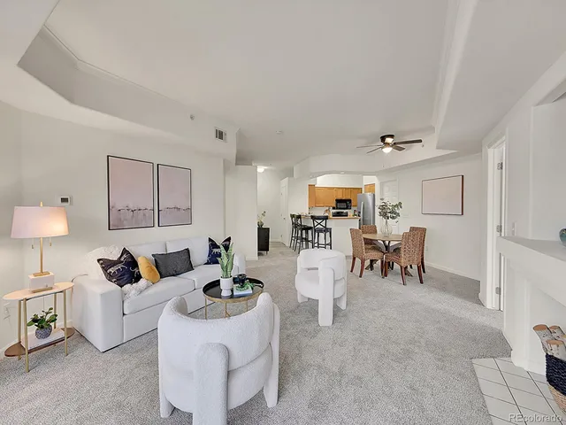 a living room with furniture and a table