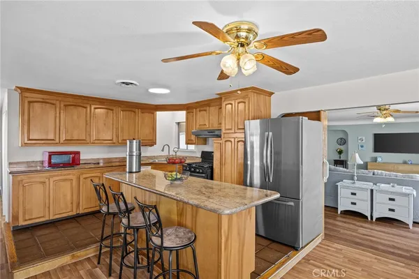 a kitchen with a sink stove and refrigerator