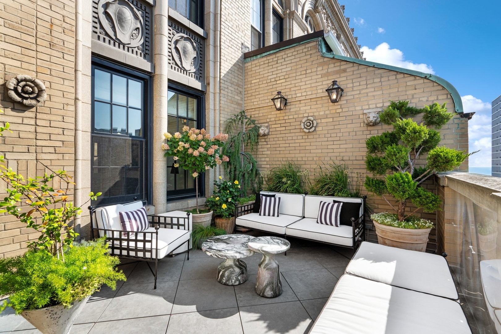 3100 North Sheridan Road, Unit 14B Chicago, IL 60657 - Photo 14 of 50 a view of a patio with couches and a potted plant