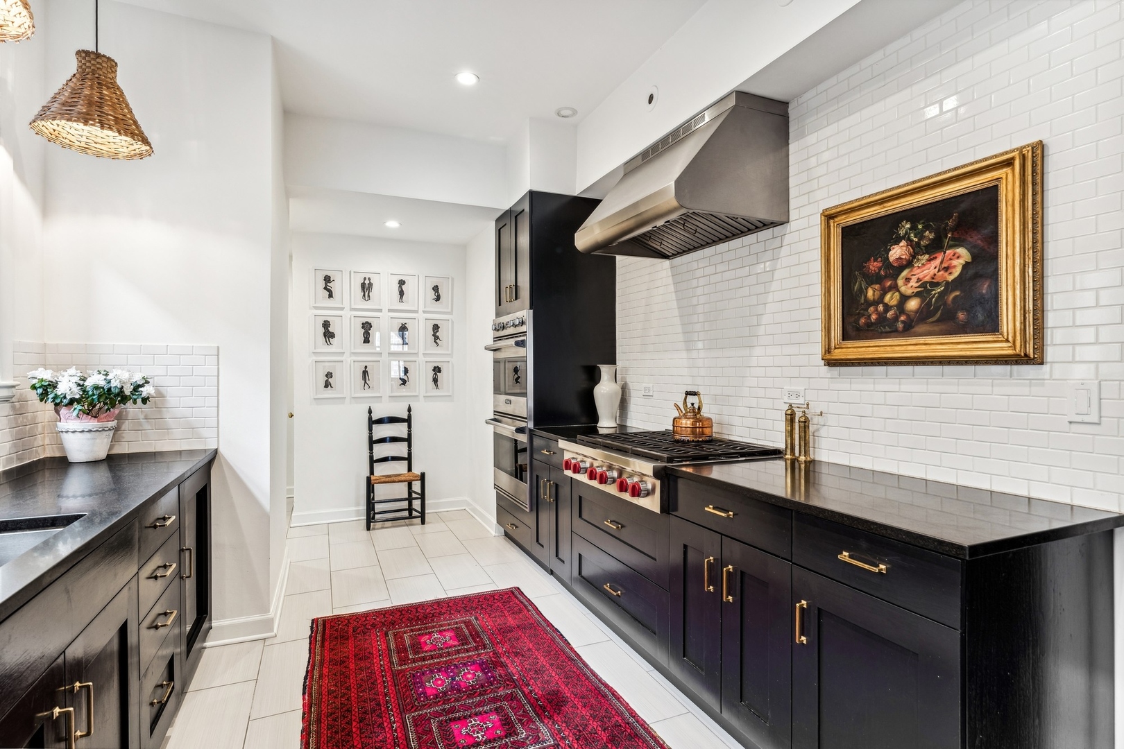 3100 North Sheridan Road, Unit 14B Chicago, IL 60657 - Photo 28 of 50 a kitchen with stainless steel appliances a sink stove and cabinets