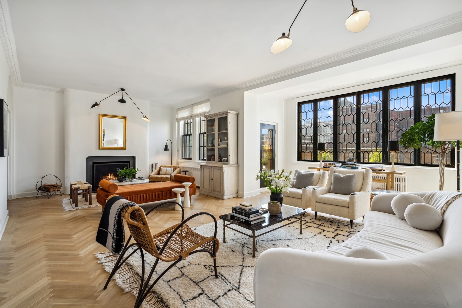 3100 North Sheridan Road, Unit 14B Chicago, IL 60657 - Photo 4 of 50 a living room with furniture a fireplace and a floor to ceiling window