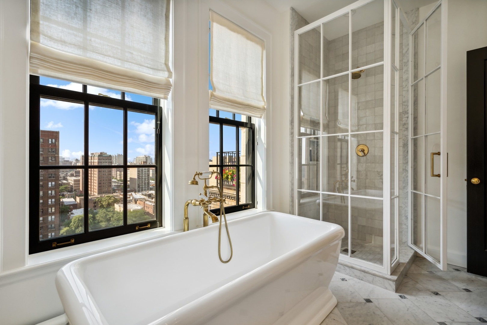 3100 North Sheridan Road, Unit 14B Chicago, IL 60657 - Photo 42 of 50 a bathroom with a tub and windows