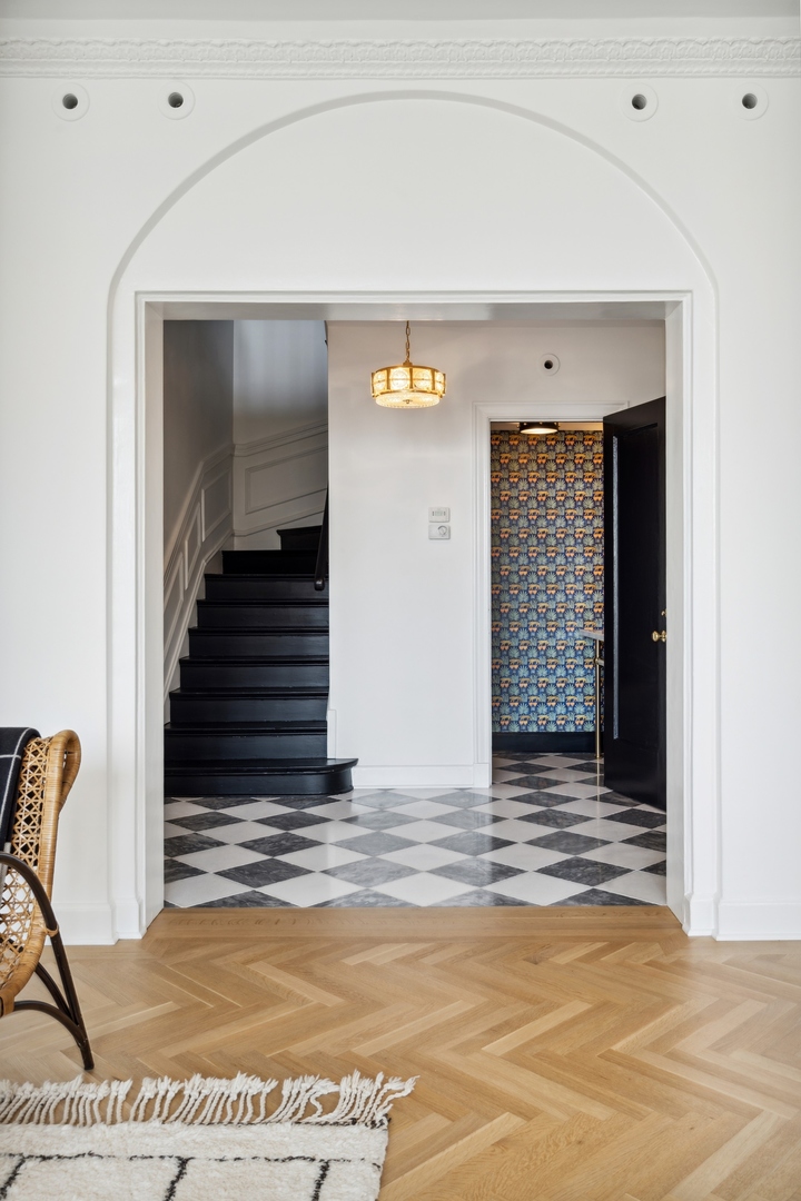3100 North Sheridan Road, Unit 14B Chicago, IL 60657 - Photo 48 of 50 a view of a livingroom with wooden floor and stairs