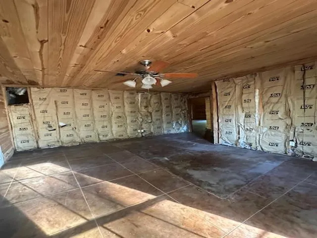 a view of a hallway with windows