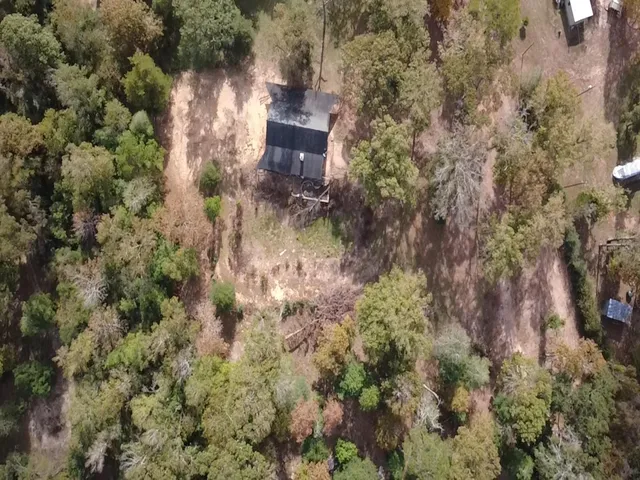 an aerial view of residential house with outdoor space