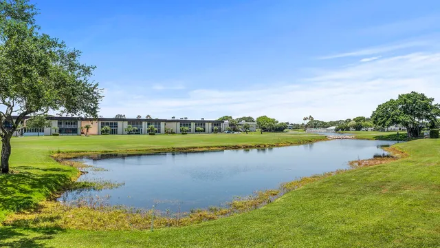 a view of a lake with a house in the background