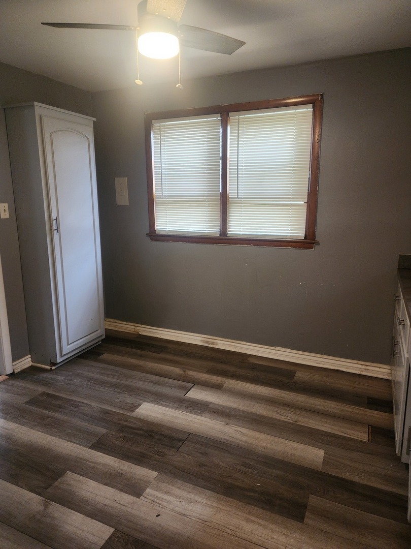 948 West Vermont Street Chicago, IL 60643 - Photo 8 of 9 a view of a livingroom with wooden floor and window