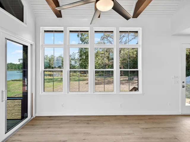 a view of a living room and entryway with wooden floor