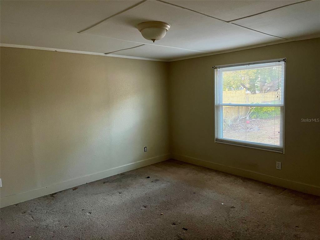 9525 Scot Street Hudson, FL 34669 - Photo 13 of 17 an empty room with a window