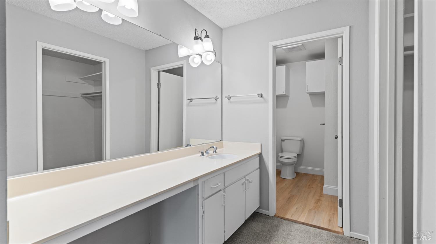 6454 Amberwood Street Rohnert Park, CA 94928 - Photo 9 of 18 Contiguous to the primary bedroom is this bathroom, the toilet and shower separated from the closet and vanity/sink area.