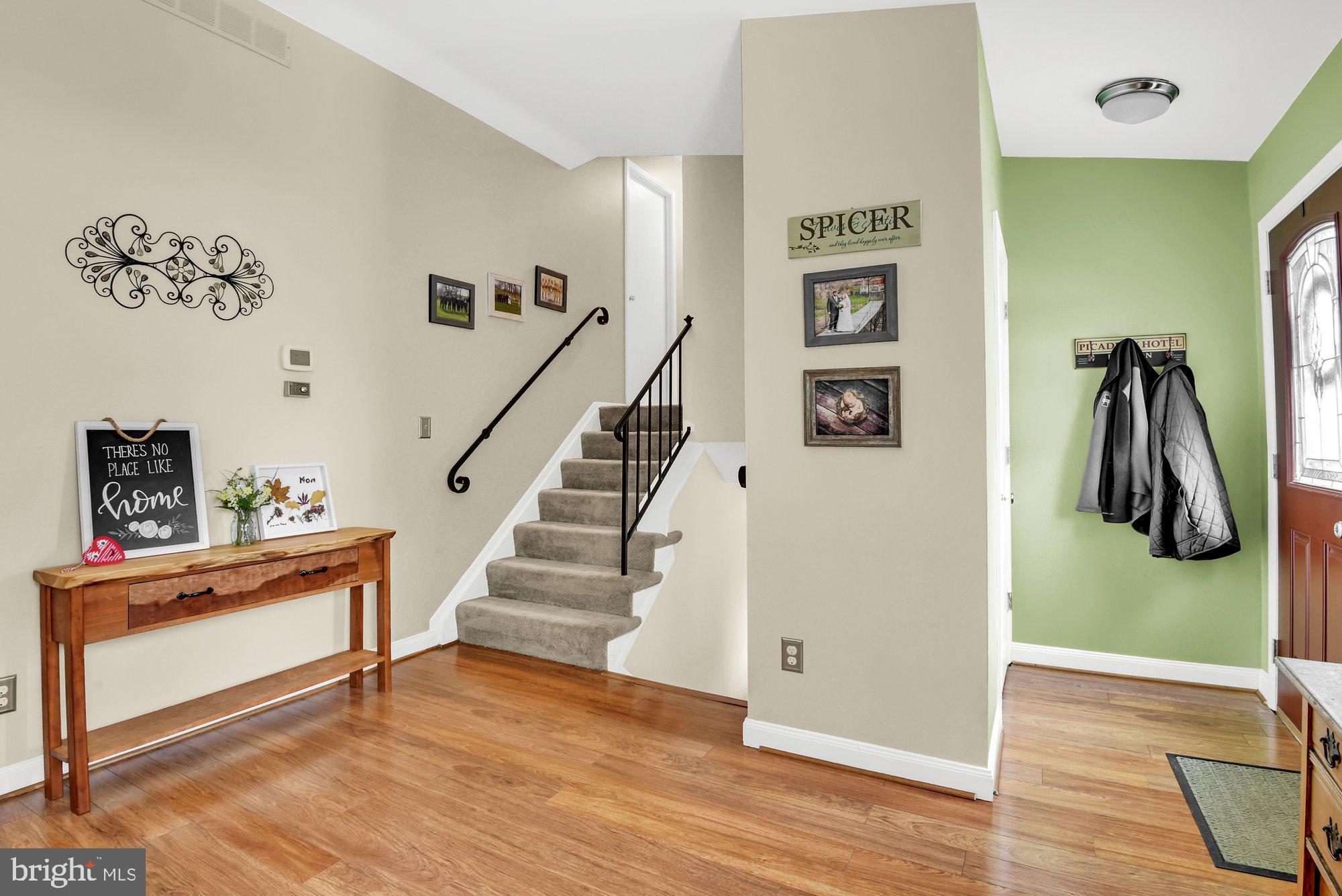 806 Uniontown Road Westminster, MD 21158 - Photo 2 of 10 a view of a hallway with wooden floor and stairs