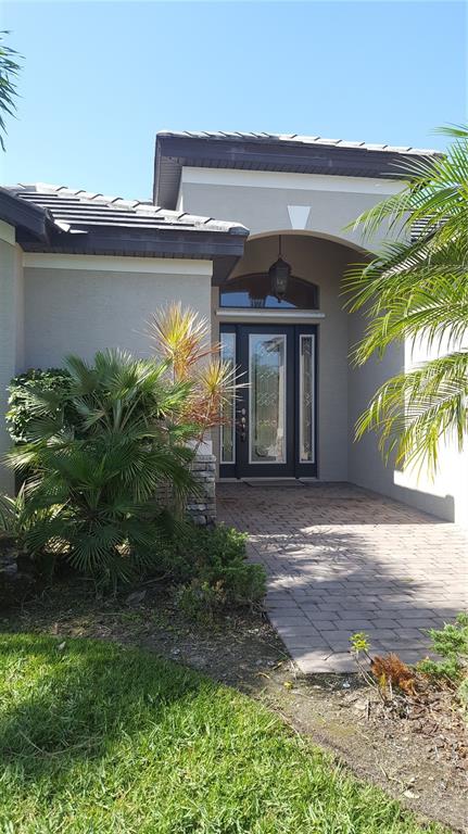 7608 Rio Bella Place Bradenton, FL 34201 - Photo 1 of 26 a view of a house with a yard
