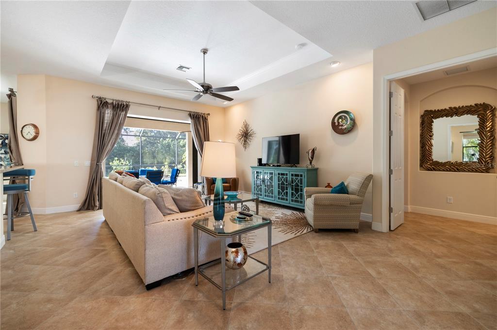 7608 Rio Bella Place Bradenton, FL 34201 - Photo 12 of 26 a living room with furniture and a large window