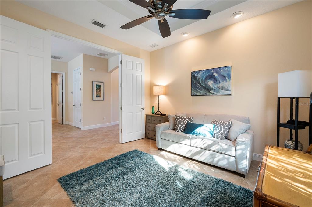 7608 Rio Bella Place Bradenton, FL 34201 - Photo 15 of 26 a living room with furniture and a rug