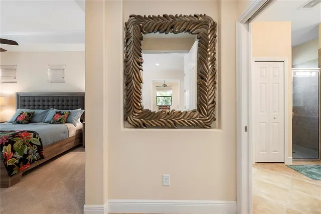 a bedroom with a bed rug and window