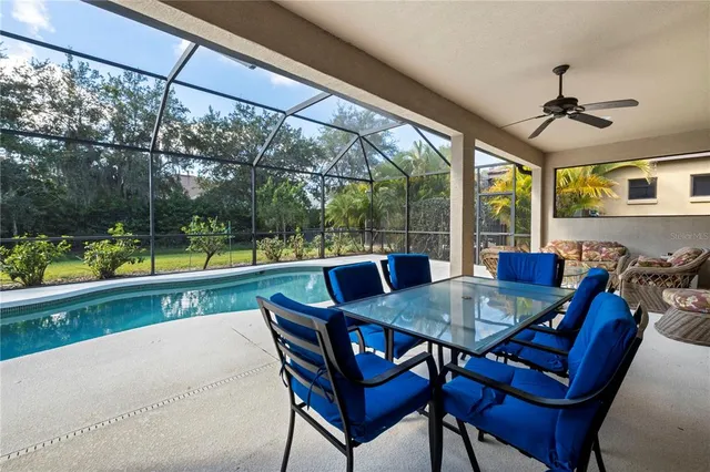 a living room with a couch and a floor to ceiling window