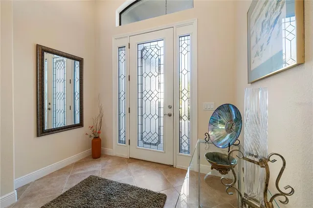 a view of an entryway with wooden floor and mirror