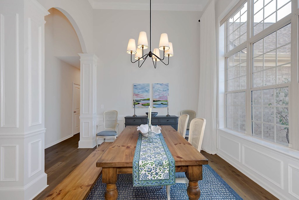 6712 Bridge Way Columbus, GA 31904 - Photo 6 of 36 a view of a dining room with furniture wooden floor and chandelier