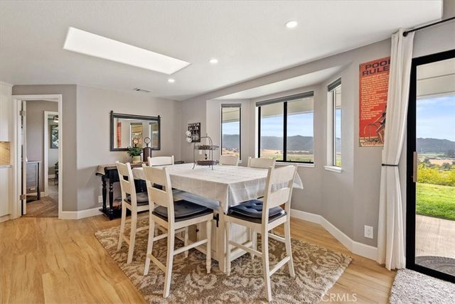 a bathroom with a toilet a sink and a mirror