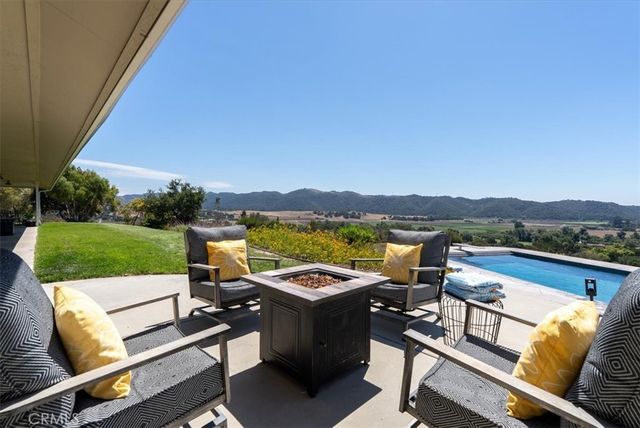 a bathroom with a toilet and a mirror