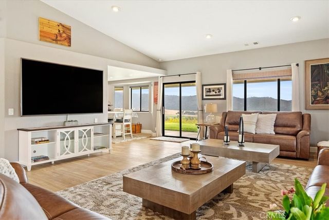 a view of a living room and a wooden floor