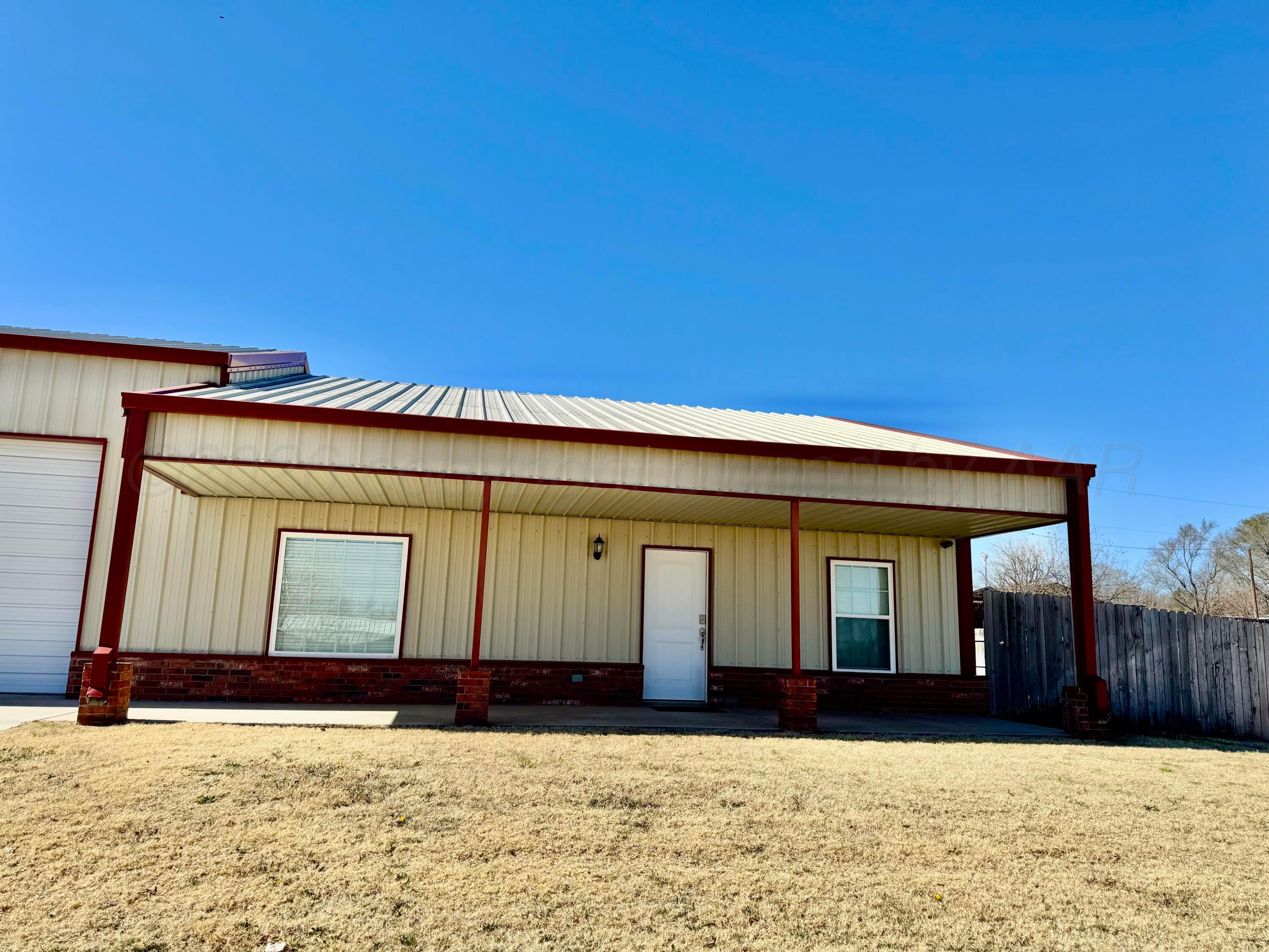 a view of house with yard