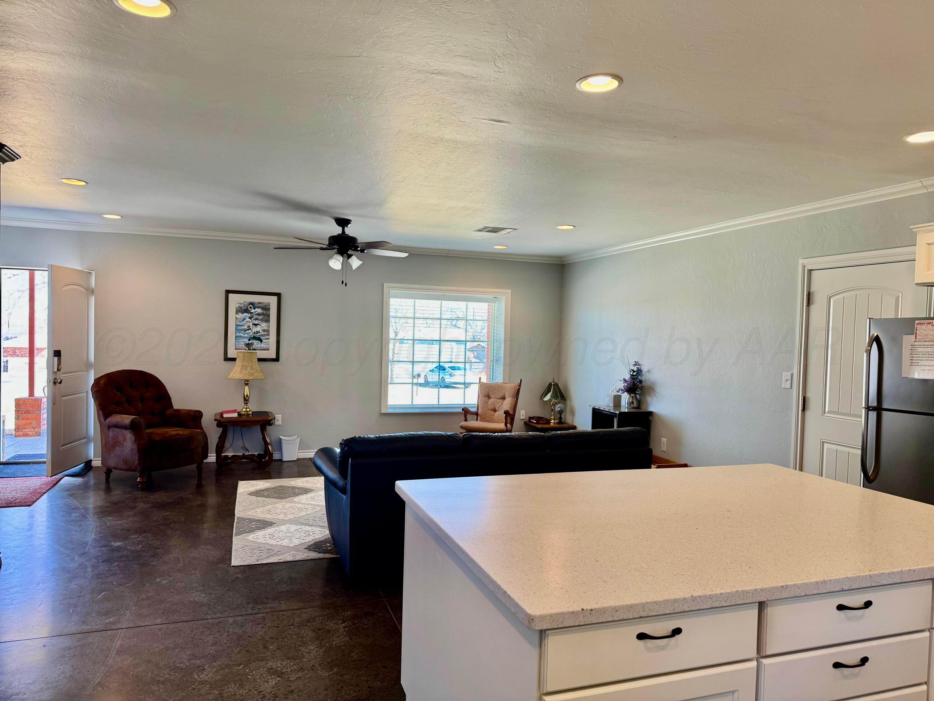 613 North 8th Street Canadian, TX 79014 - Photo 3 of 6 a living room with furniture and a large window