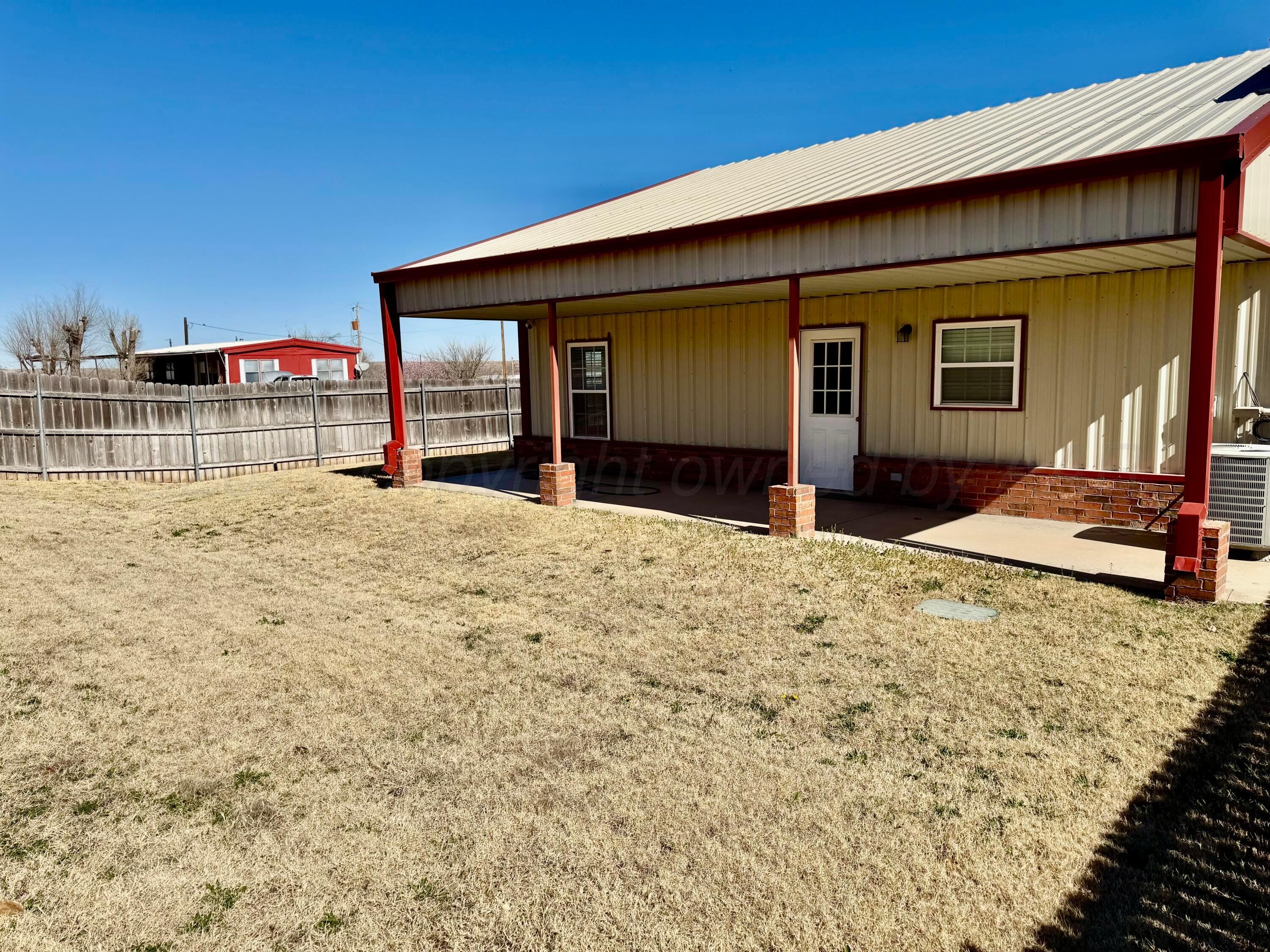 613 North 8th Street Canadian, TX 79014 - Photo 6 of 6 a view of a house with a patio