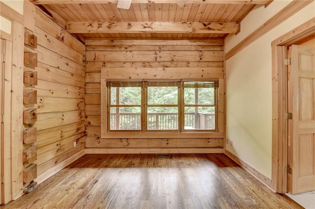 82 Walnut Grove Lane Tiger, GA 30576 - Photo 40 of 88 a view of empty room with wooden floor and fan