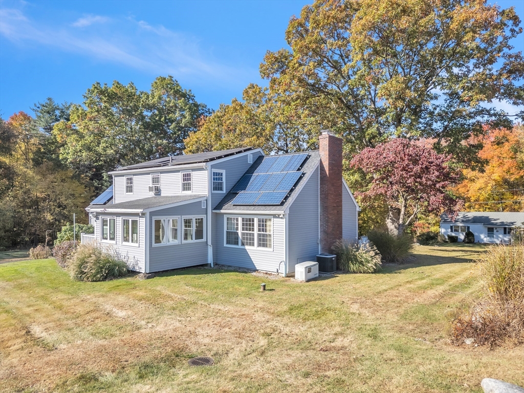 50 Old Wilson Road Northampton, MA 01062 - Photo 5 of 42 a front view of a house with a yard and large trees