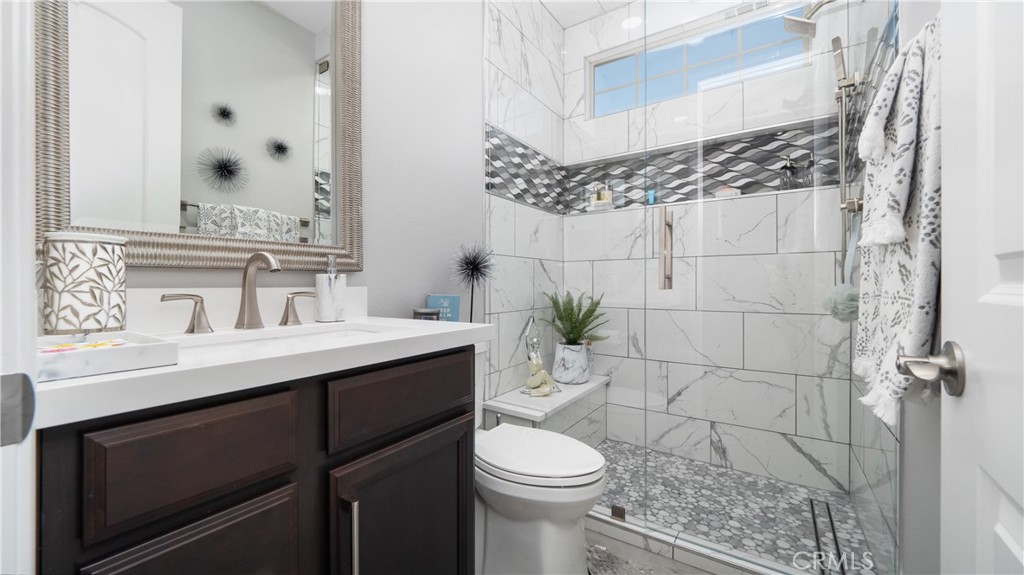 4699 Reflection Lane Ontario, CA 91762 - Photo 12 of 32 a bathroom with a sink toilet and shower