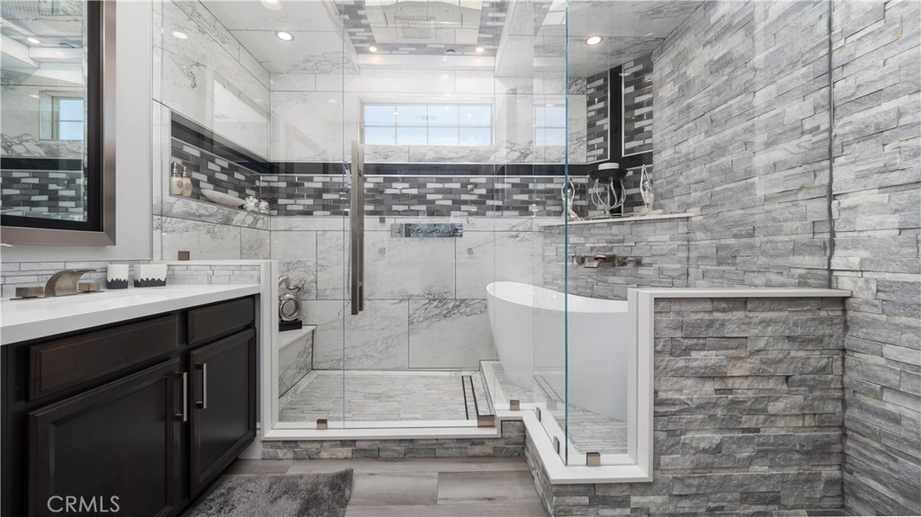 4699 Reflection Lane Ontario, CA 91762 - Photo 16 of 32 a bathroom with a sink and a mirror