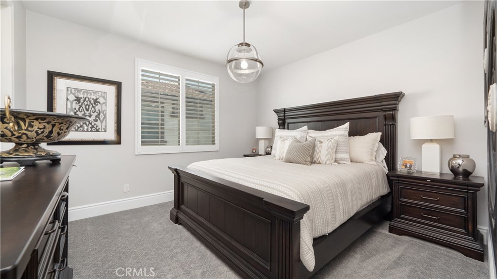 4699 Reflection Lane Ontario, CA 91762 - Photo 18 of 32 a bedroom with a bed and a window