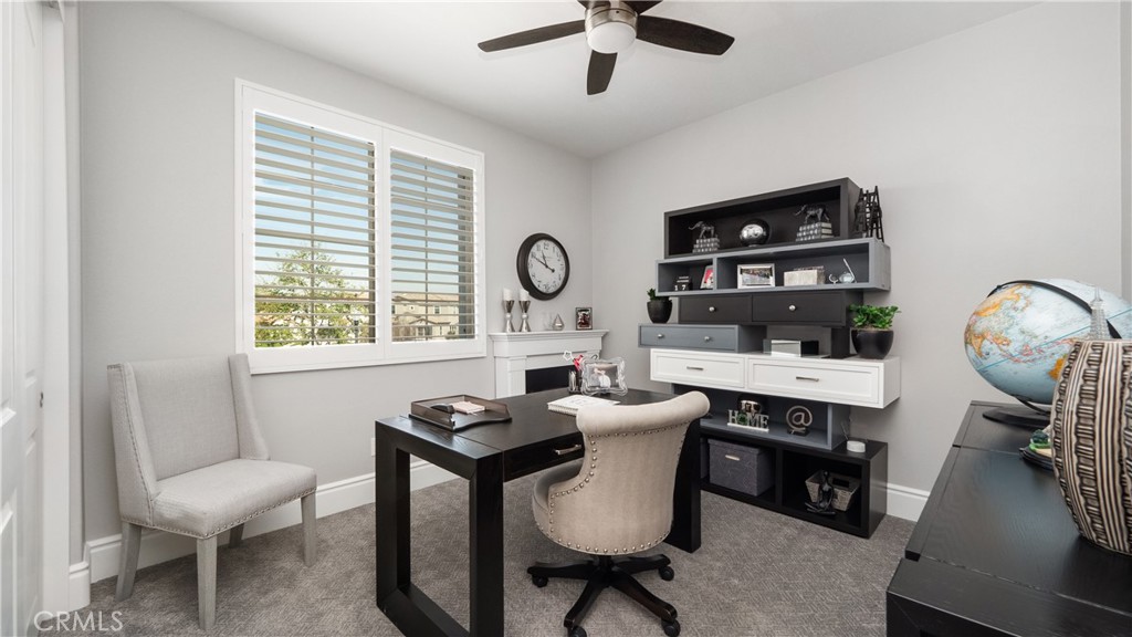 4699 Reflection Lane Ontario, CA 91762 - Photo 19 of 32 a view of a workspace with furniture and a window