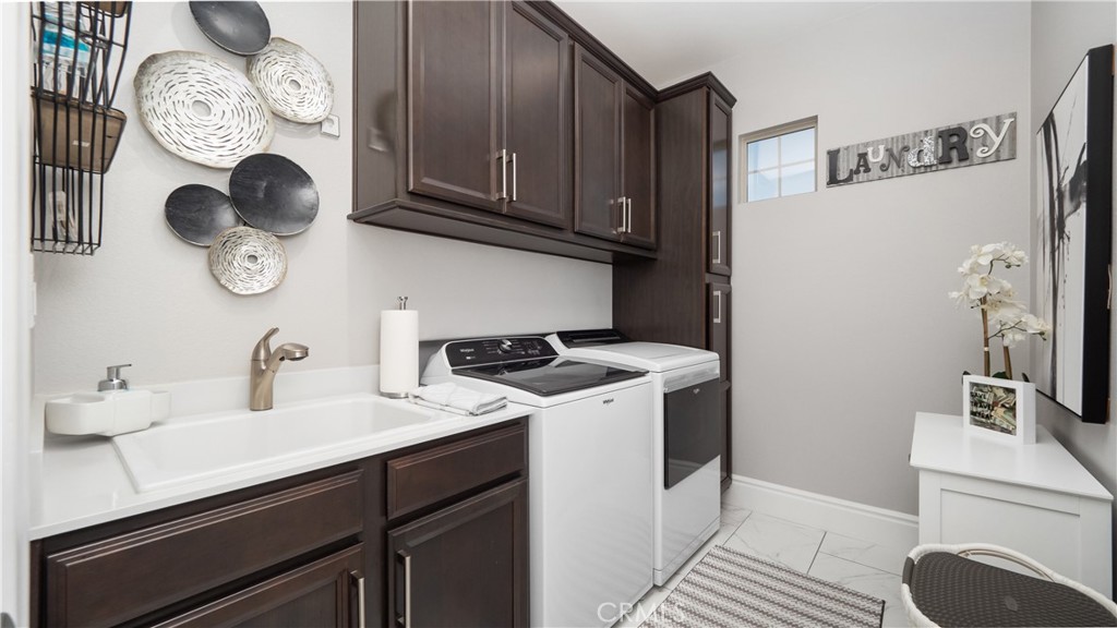 4699 Reflection Lane Ontario, CA 91762 - Photo 22 of 32 a kitchen with stainless steel appliances granite countertop a sink and a stove with wooden floor