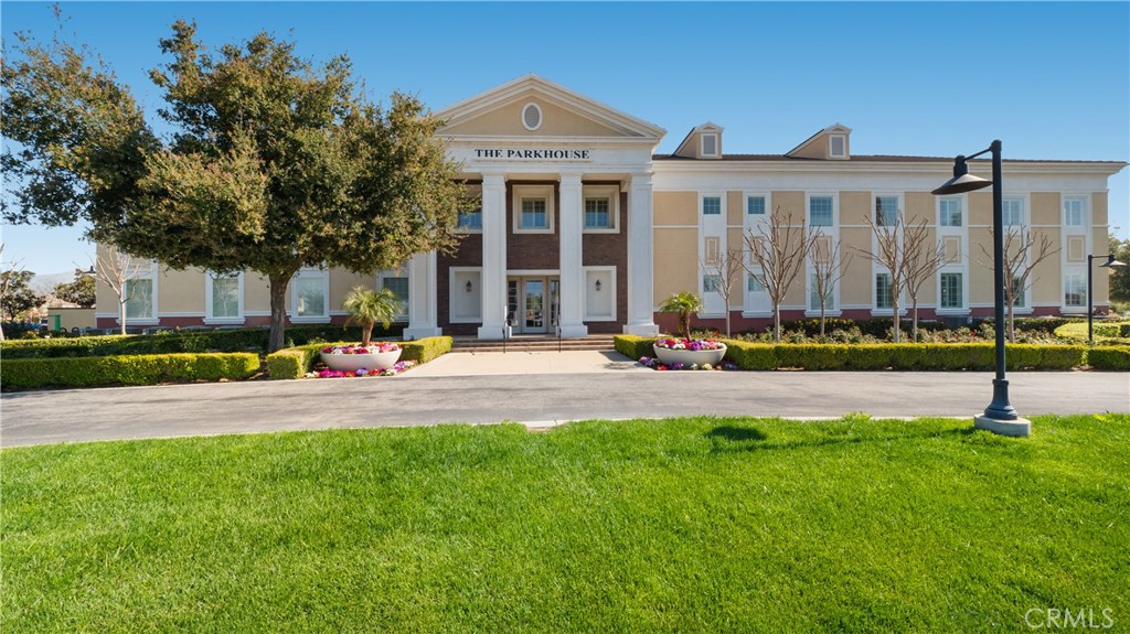 4699 Reflection Lane Ontario, CA 91762 - Photo 29 of 32 a front view of building with yard and outdoor seating