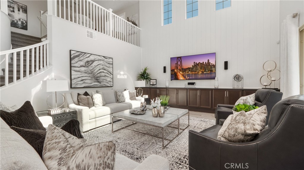 4699 Reflection Lane Ontario, CA 91762 - Photo 8 of 32 a living room with furniture and wall paintings