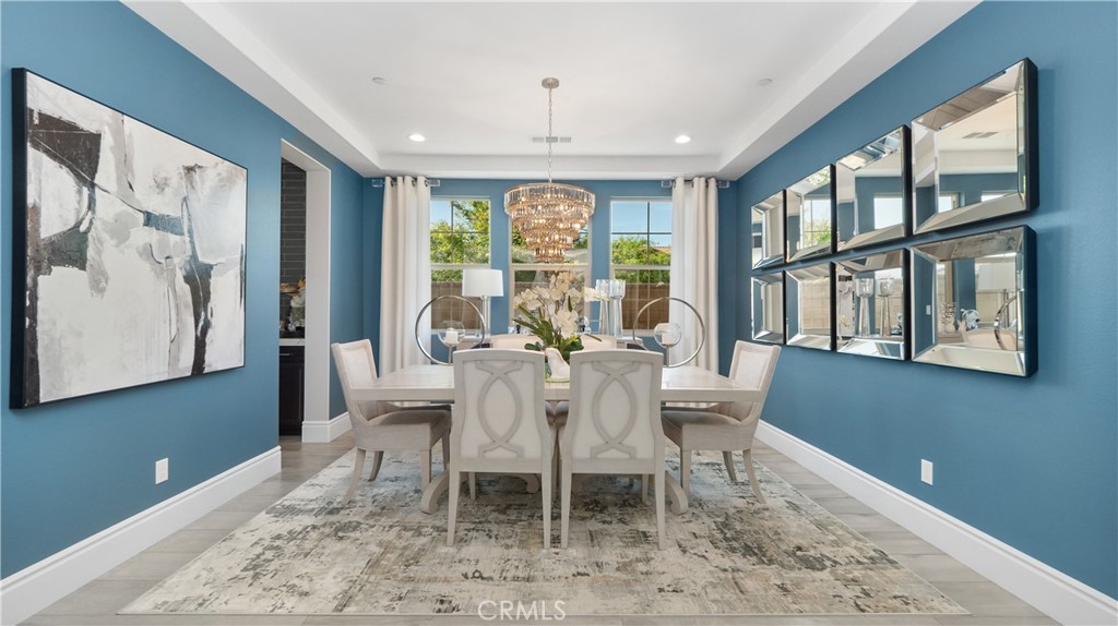 4699 Reflection Lane Ontario, CA 91762 - Photo 10 of 32 a dining room with wooden floor and a window