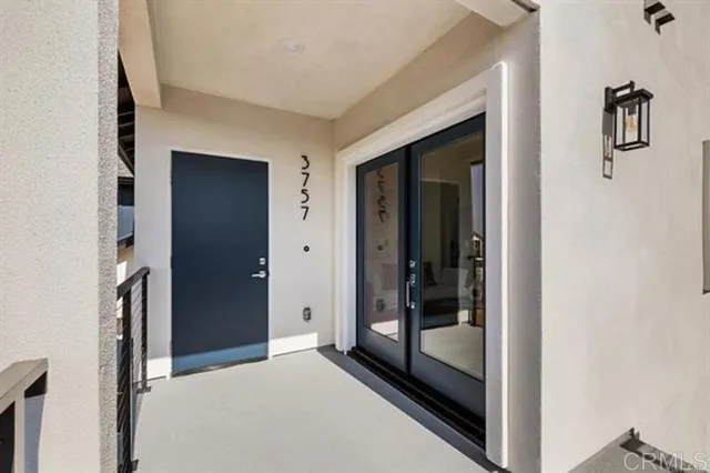 a view of front door and bedroom