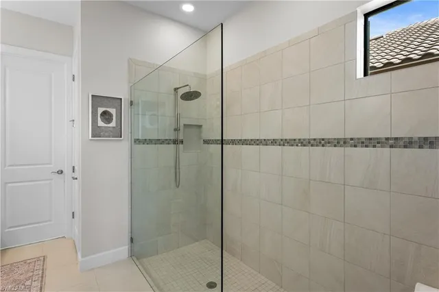 a bathroom with a shower and a sink