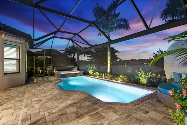 a view of a swimming pool with a patio