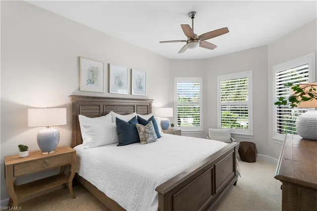 a bathroom with a granite countertop tub sink and mirror