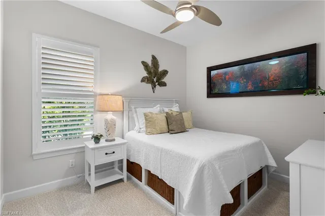 a bathroom with a granite countertop shower sink vanity mirror and toilet